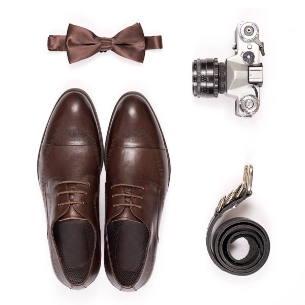 Top view of essentials for modern person. Men accessories isolated on white background.