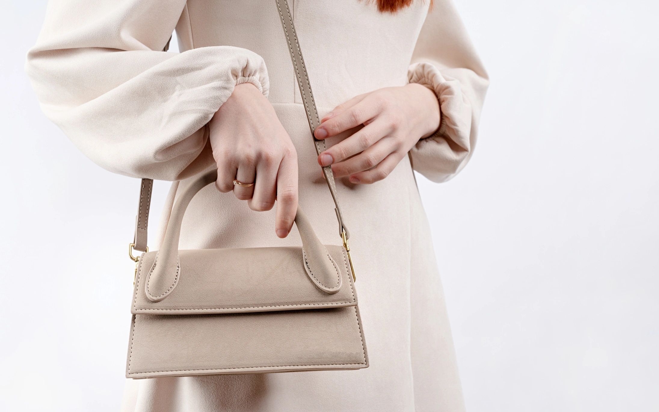 Woman in white dress with fashion bag