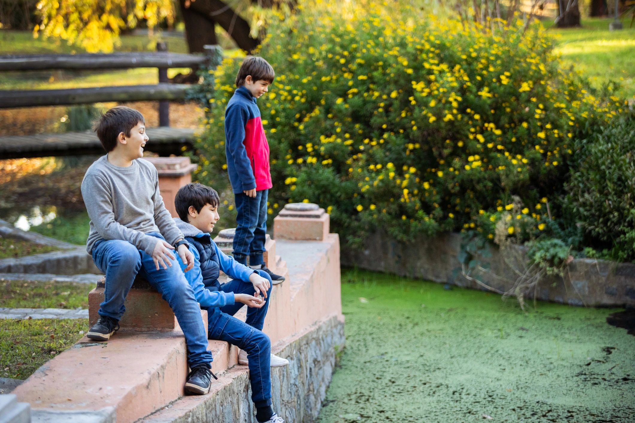 Children playing outdoors in casual outfits