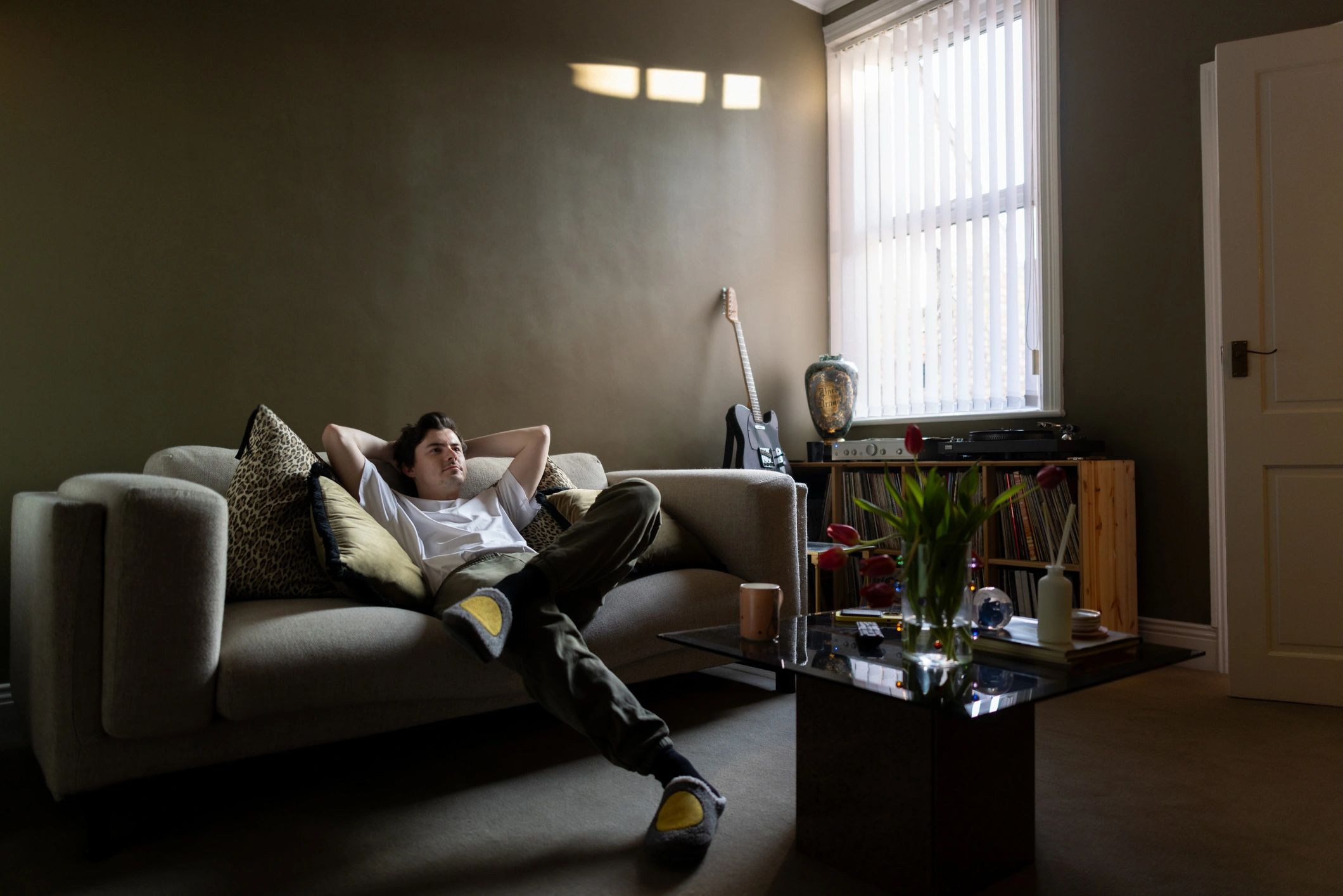 Man relaxing at home in casual clothing