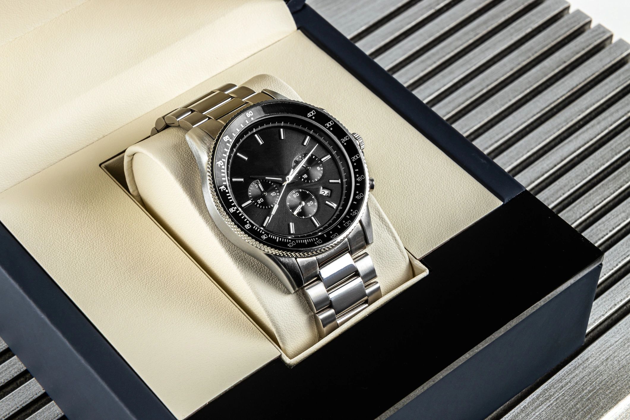 Modern men’s wristwatch with black dial and stainless steel bracelet