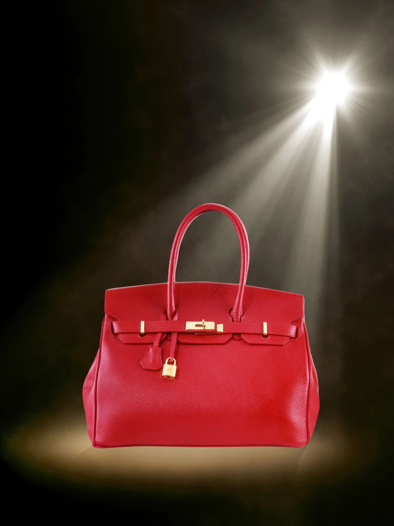 Luxury red leather handbag with gold hardware
