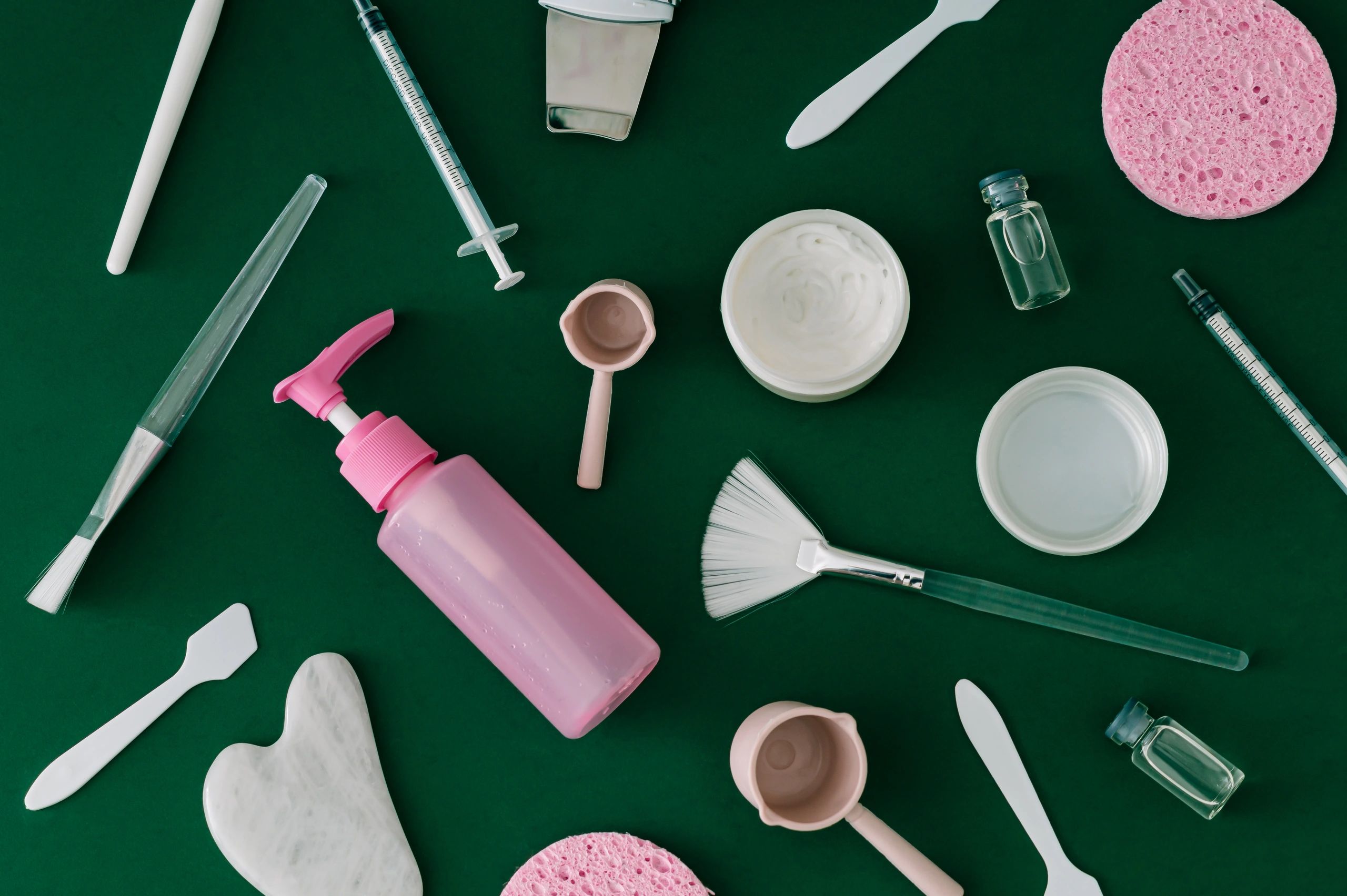 Luxury skincare and beauty accessories arranged in a flat lay
