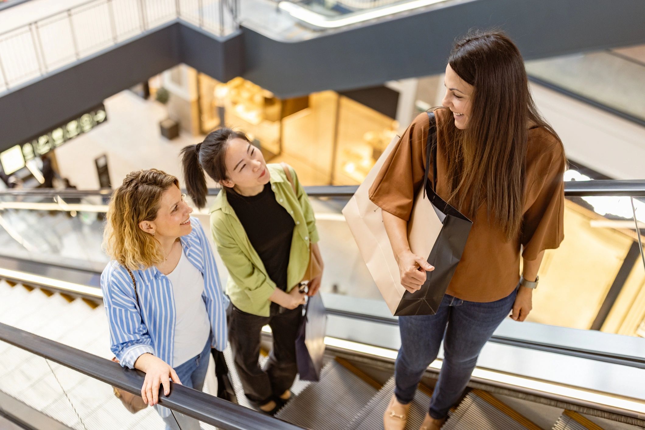 Friends shopping in a modern mall